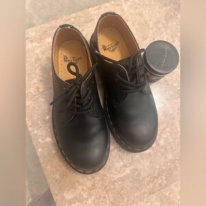 Dr. Martens Kids size 4 (girl or boy) balm is included